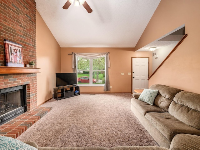 living room featuring carpet flooring, baseboards, a fireplace, and a ceiling fan