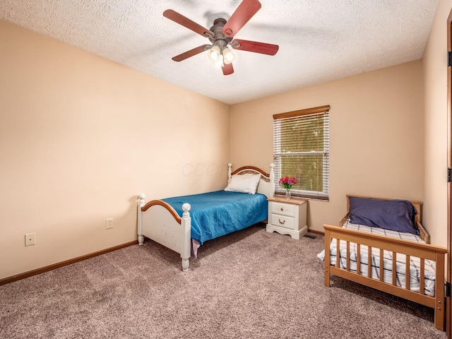 bedroom with baseboards, carpet flooring, and a textured ceiling