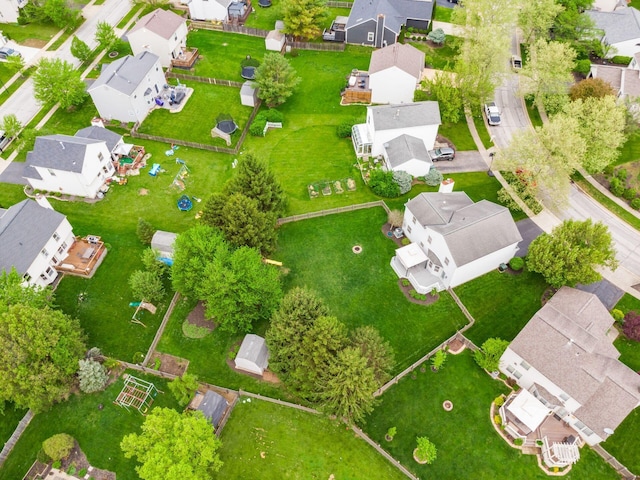 birds eye view of property with a residential view