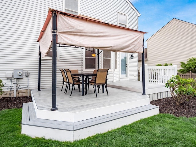 wooden deck with outdoor dining area