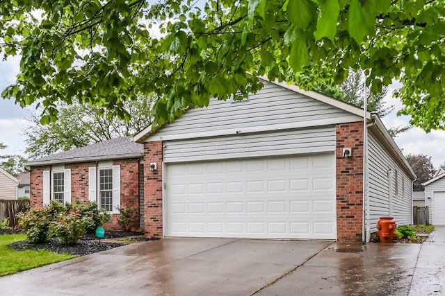 view of front of property with brick siding, concrete driveway, and an attached garage