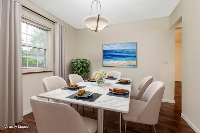 dining room with baseboards