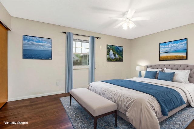 bedroom featuring dark wood-style flooring, baseboards, and a ceiling fan