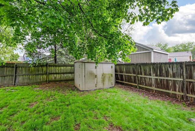 view of yard with a shed and an outbuilding