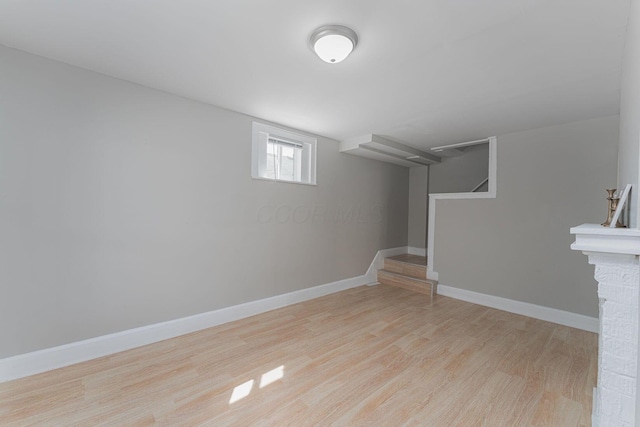 901 Campbell Ave, Columbus, OH 43223 - below grade area featuring wood finished floors, baseboards, and stairs