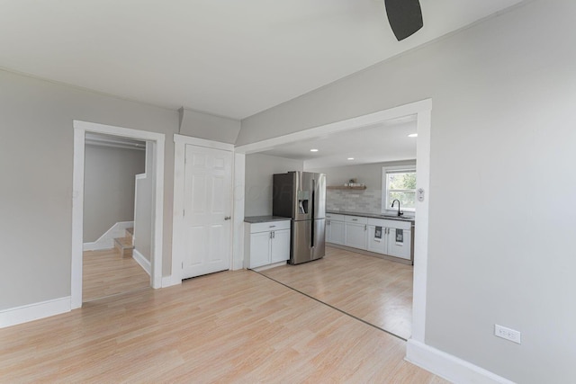 901 Campbell Ave, Columbus, OH 43223 - unfurnished living room with light wood finished floors, a sink, baseboards, ceiling fan, and recessed lighting