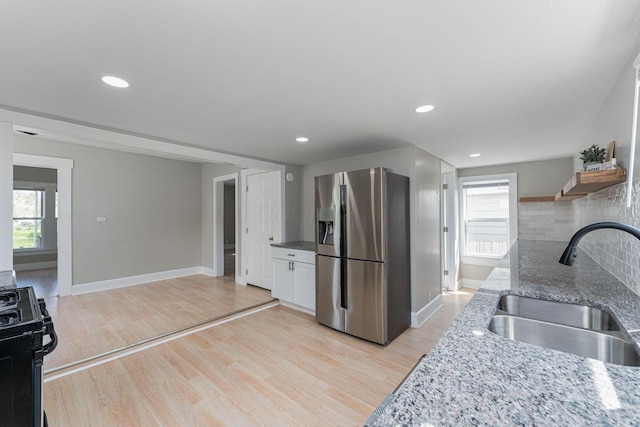 901 Campbell Ave, Columbus, OH 43223 - kitchen with stainless steel fridge with ice dispenser, a sink, gas range oven, plenty of natural light, and recessed lighting