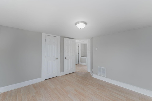 901 Campbell Ave, Columbus, OH 43223 - unfurnished bedroom with wood finished floors, baseboards, and a closet