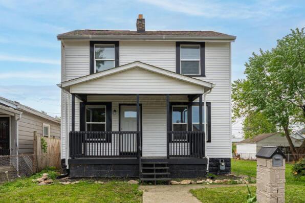 901 Campbell Ave, Columbus, OH 43223 - view of front of house featuring covered porch, fence, and a chimney