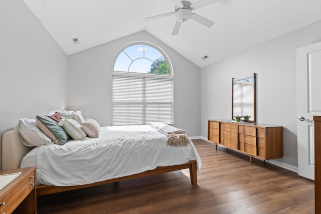 7742 Blue Juniper Dr, Westerville, OH 43082 - bedroom with dark wood-style floors, lofted ceiling, multiple windows, ceiling fan, and baseboards