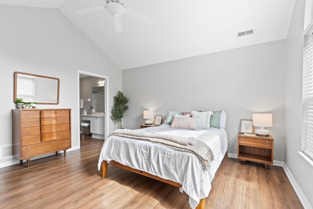 7742 Blue Juniper Dr, Westerville, OH 43082 - bedroom with wood finished floors, high vaulted ceiling, baseboards, ensuite bath, and a ceiling fan