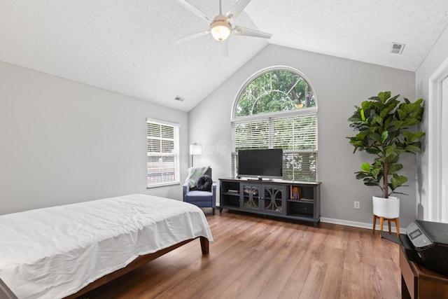 7742 Blue Juniper Dr, Westerville, OH 43082 - bedroom with lofted ceiling, wood finished floors, a textured ceiling, a ceiling fan, and baseboards