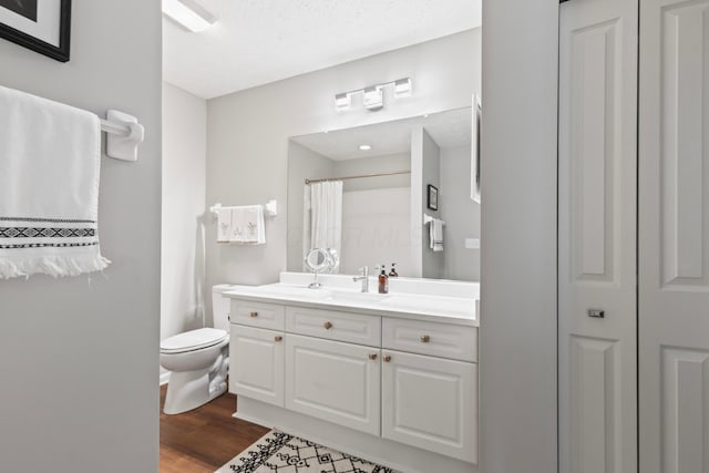 7742 Blue Juniper Dr, Westerville, OH 43082 - bathroom featuring wood finished floors, toilet, vanity, and a shower with shower curtain