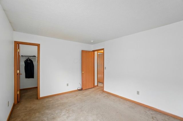 3217 Easthaven Dr S, Columbus, OH 43232 - unfurnished bedroom featuring a walk in closet, carpet flooring, and baseboards