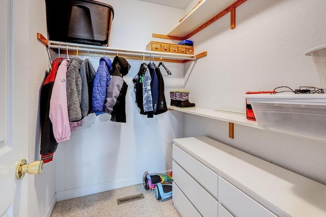 spacious closet featuring visible vents