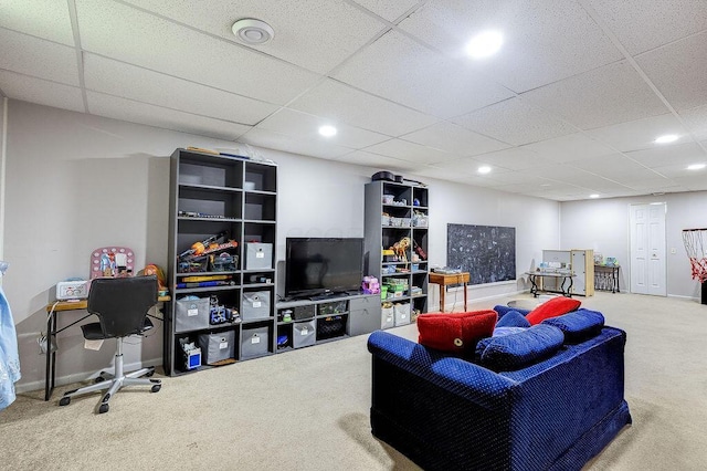 living room with recessed lighting, carpet floors, and a drop ceiling