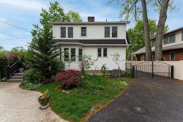 2842 Powell Ave, Columbus, OH 43209 - colonial inspired home featuring a gate, a chimney, and central AC