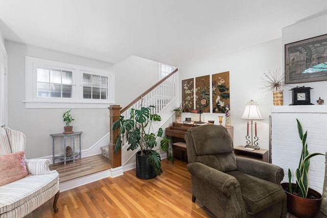 2842 Powell Ave, Columbus, OH 43209 - sitting room with stairs, wood finished floors, plenty of natural light, and baseboards