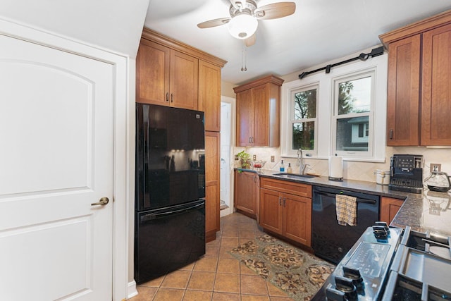 2842 Powell Ave, Columbus, OH 43209 - kitchen featuring black appliances, a sink, light tile patterned floors, and brown cabinets