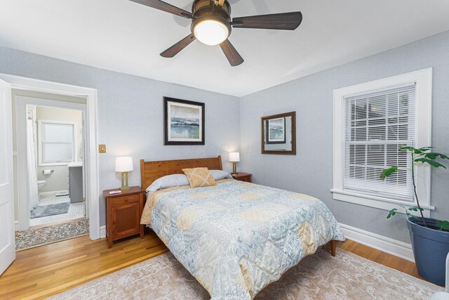 2842 Powell Ave, Columbus, OH 43209 - bedroom with wood finished floors, baseboards, and a ceiling fan