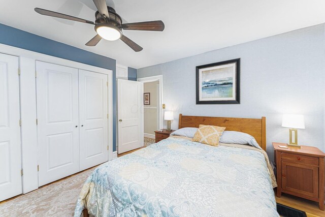 2842 Powell Ave, Columbus, OH 43209 - bedroom with a closet, light wood-style floors, and a ceiling fan