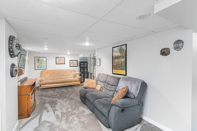 2842 Powell Ave, Columbus, OH 43209 - living area featuring carpet flooring, a drop ceiling, and baseboards
