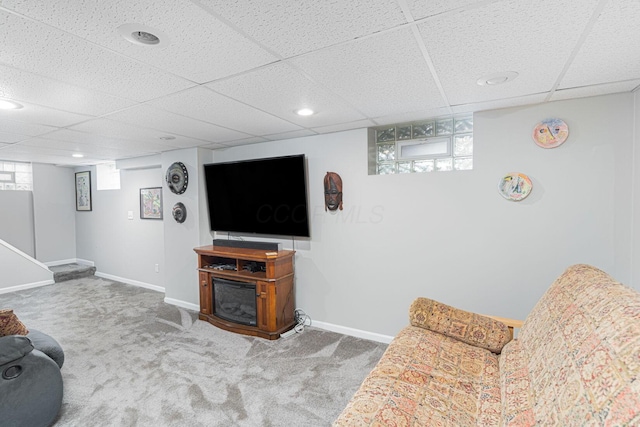 2842 Powell Ave, Columbus, OH 43209 - living area featuring a paneled ceiling, carpet, and baseboards