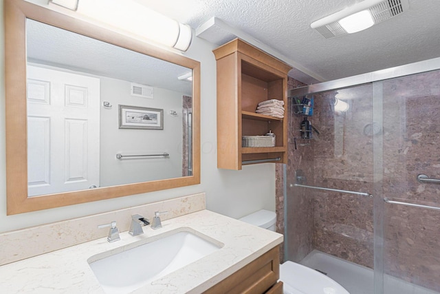 2842 Powell Ave, Columbus, OH 43209 - bathroom with toilet, vanity, a textured ceiling, and a stall shower