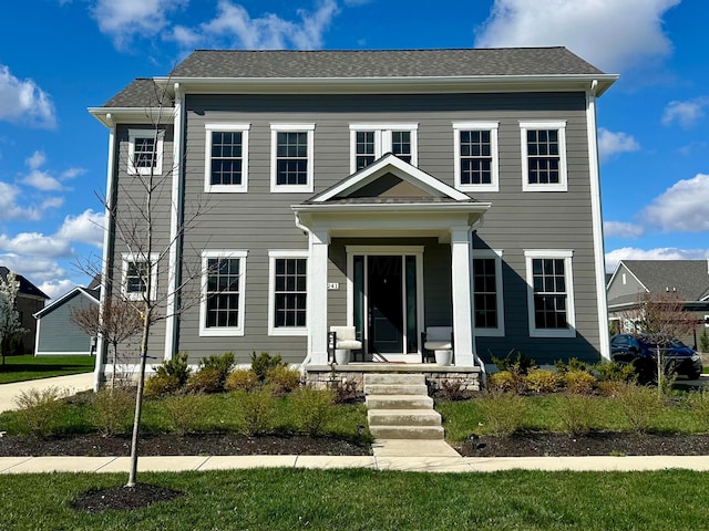 colonial house featuring covered porch