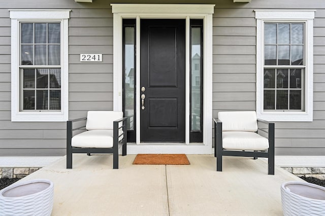 doorway to property with a porch