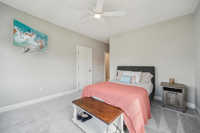 carpeted bedroom featuring baseboards and a ceiling fan
