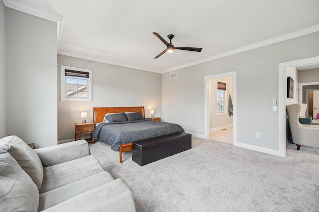 carpeted bedroom featuring ornamental molding, baseboards, connected bathroom, and ceiling fan
