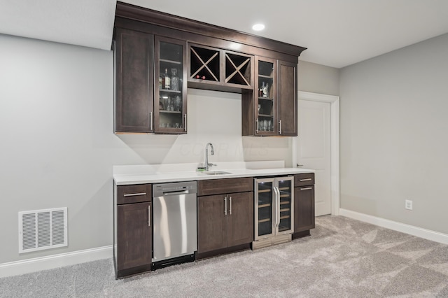 indoor wet bar featuring dishwasher, beverage cooler, baseboards, light carpet, and recessed lighting