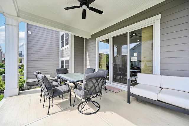 view of patio / terrace with a ceiling fan and outdoor dining space