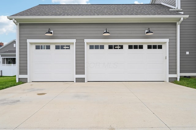 garage with concrete driveway
