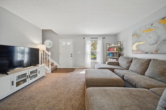 4097 Garrard Dr, Obetz, OH 43207 - carpeted living area with stairs, a textured ceiling, and baseboards