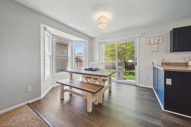 4097 Garrard Dr, Obetz, OH 43207 - dining room with baseboards, dark wood finished floors, and a textured ceiling
