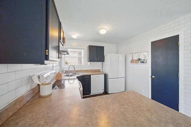4097 Garrard Dr, Obetz, OH 43207 - kitchen with white appliances, a sink, under cabinet range hood, tile walls, and a textured ceiling