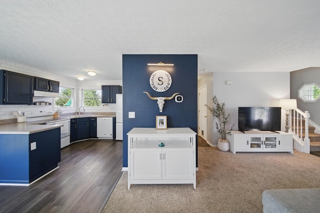 4097 Garrard Dr, Obetz, OH 43207 - kitchen with white appliances, a sink, light countertops, healthy amount of natural light, and a textured ceiling