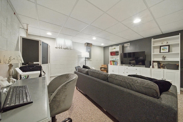 4097 Garrard Dr, Obetz, OH 43207 - carpeted living room with concrete block wall, a drop ceiling, and recessed lighting