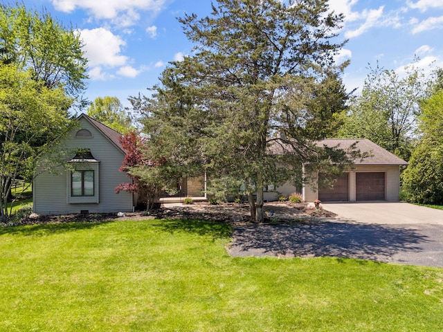 6730 Tussic Rd, Westerville, OH 43082 - view of property hidden behind natural elements with concrete driveway, a front yard, and a garage