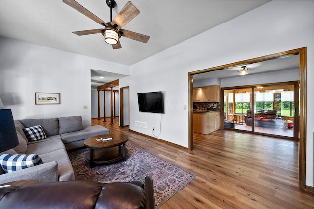 6730 Tussic Rd, Westerville, OH 43082 - living room with wood finished floors, ceiling fan, and baseboards
