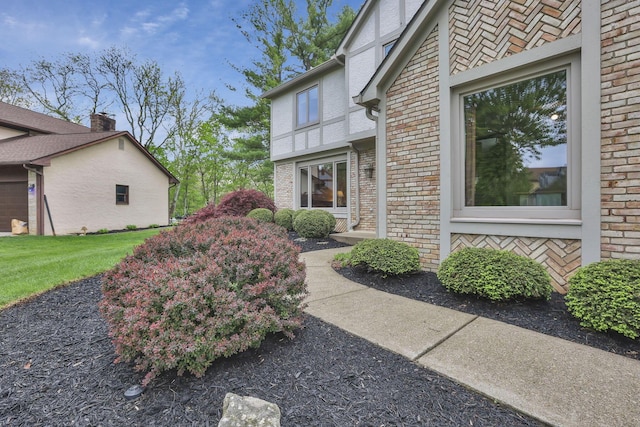 view of home's exterior featuring brick siding
