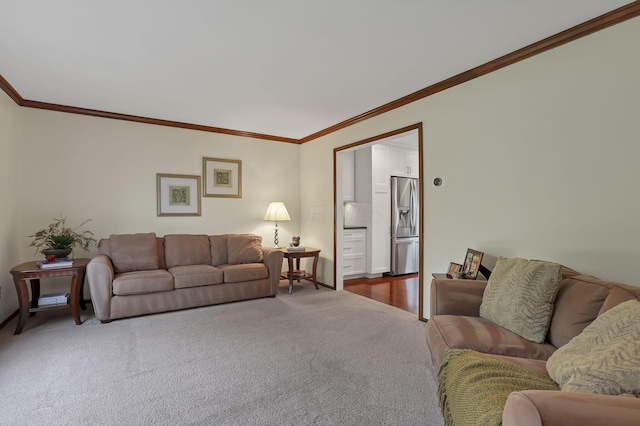 living room with ornamental molding, baseboards, and dark carpet