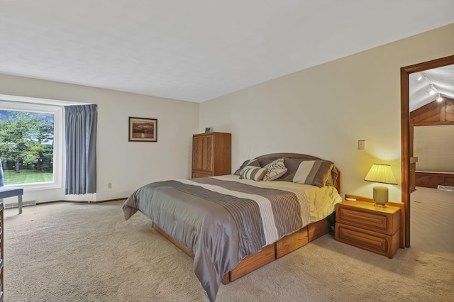 carpeted bedroom featuring baseboards
