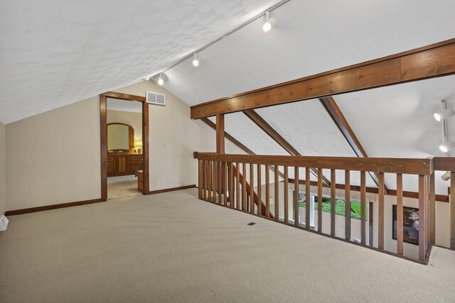bonus room with lofted ceiling, carpet, visible vents, arched walkways, and baseboards