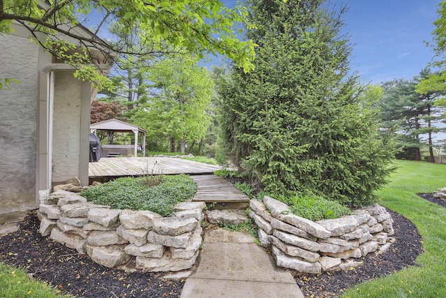 view of yard featuring a gazebo and a wooden deck