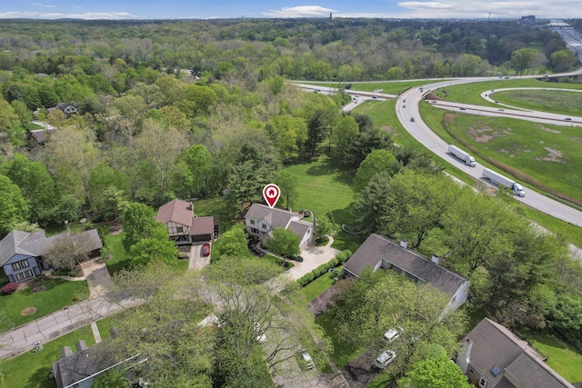 aerial view with a residential view and a wooded view