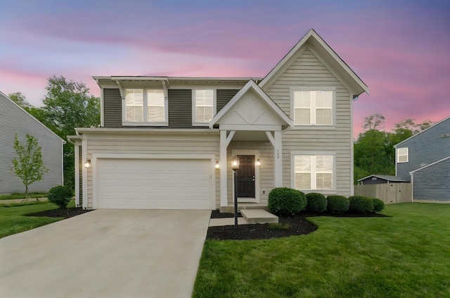 traditional home with driveway and a garage