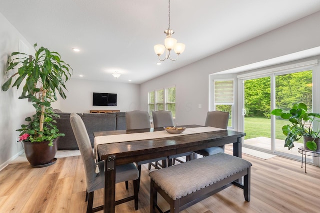dining space with light wood-style floors, a chandelier, recessed lighting, and baseboards